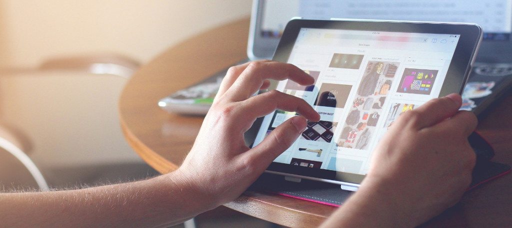 Photo of person working on tablet